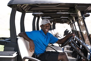 man in golf cart